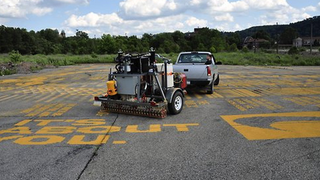 Chalkbot Pneumatically Sprays 100,000 Graffiti Messages During Tour De France